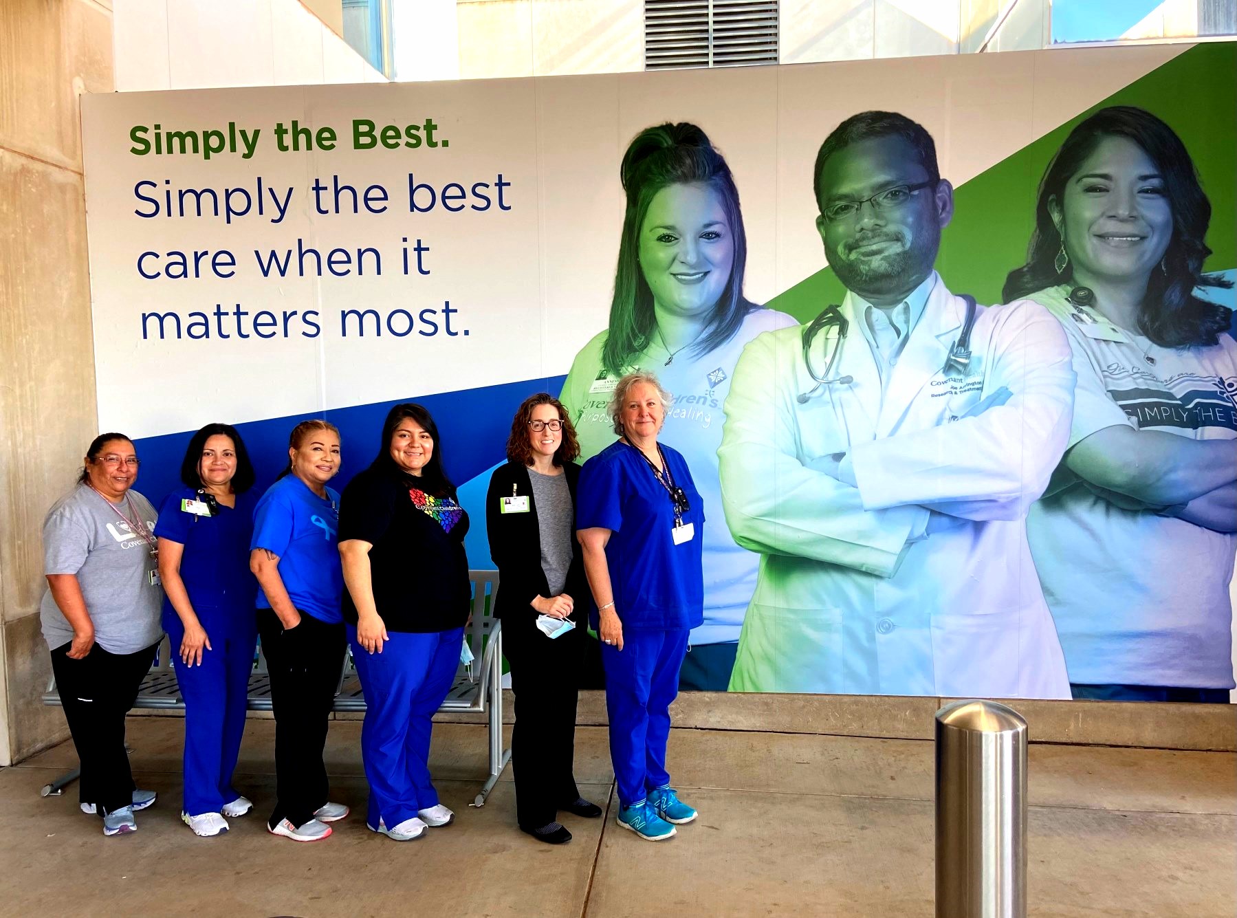 six covenant ready nurses standing in front of a sign 